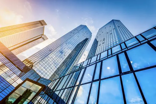 Bottom,view,of,modern,skyscrapers,in,business,district,at,sunset