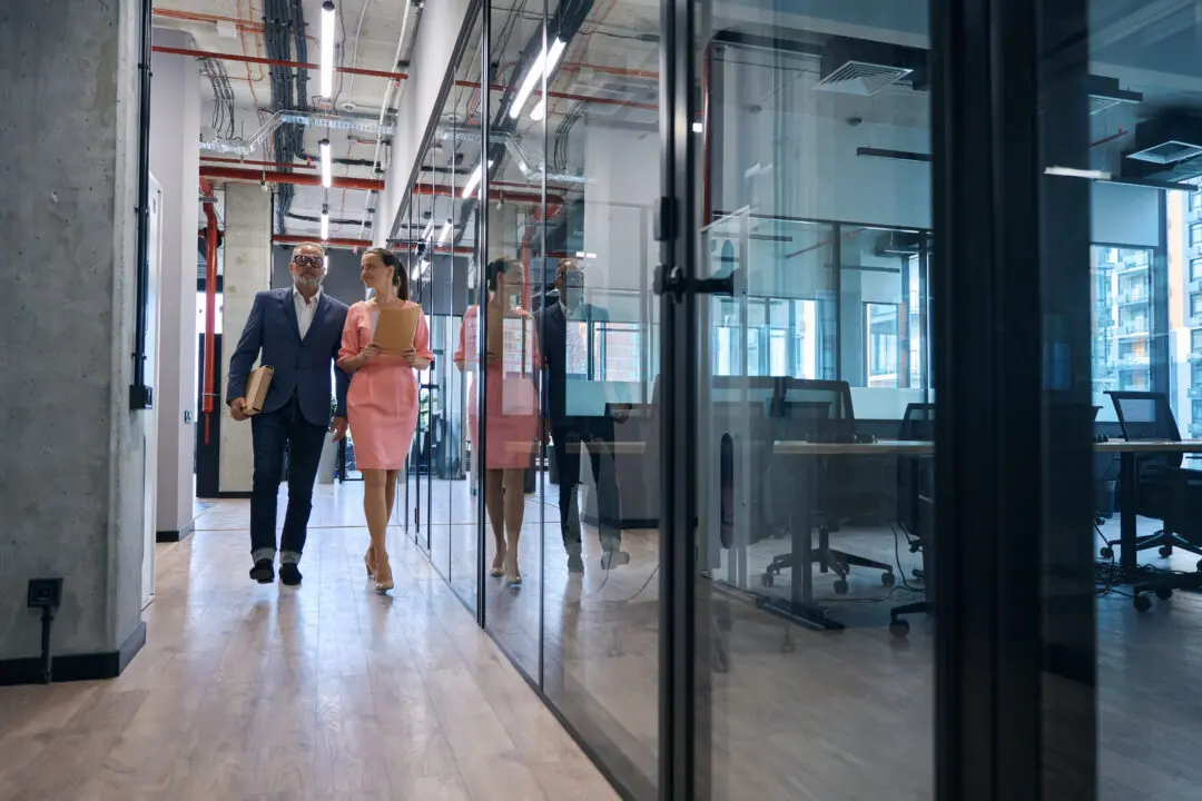 couple-of-employees-business-company-walk-along-co-2026-01-05-06-14-18-utc-scaled