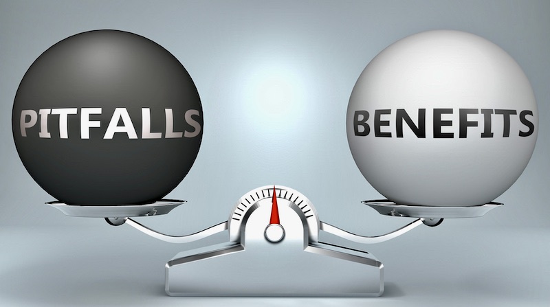 Pitfalls,and,benefits,in,balance, ,pictured,as,a,scale
