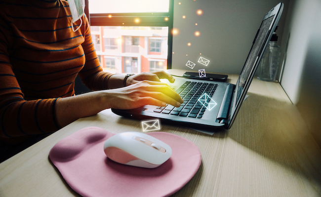 View,of,woman,working,at,home,using,laptop,computer.