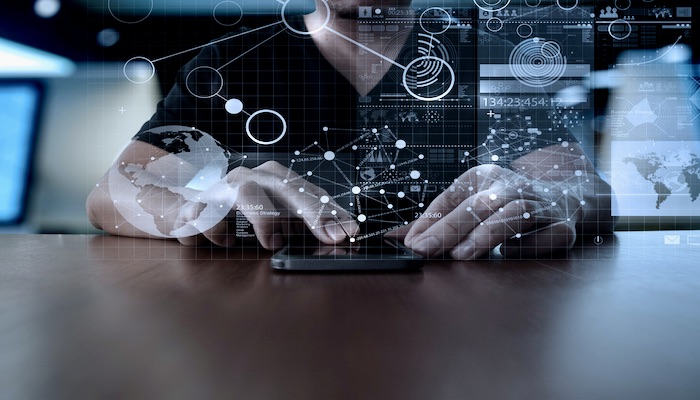 Businessman,hand,using,mobile,phone,with,digital,layer,effect,as