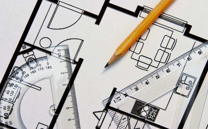 A,protractor,,pencil,and,a,setsquare,on,top,of,a